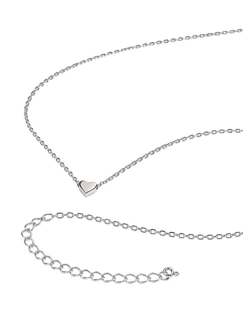 A silver chain necklace with a small heart-shaped pendant, displayed on a clean white background with an adjustable link extension chain shown below.